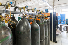 Rows Of Gray Gas Cylinders.