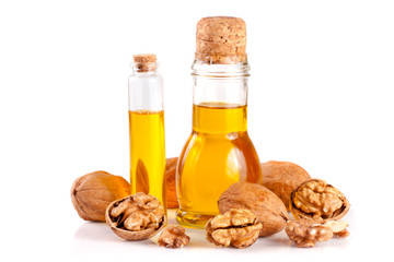 Wall Mural - Walnut oil with nuts isolated on a white background