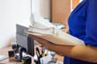 © Albina - Female office workers holding are arranging documents