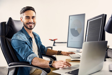Poster - Happy male having job on notebook computer