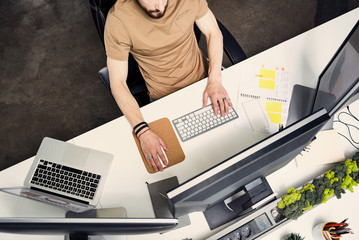 Wall Mural - Man arms pressing clavier at table