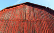 Rustic well kept red barn with a star cutout
