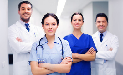 Canvas Print - happy group of medics or doctors at hospital