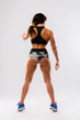 © ladie_c - Perfect Fitness Body of Beautiful Woman. Fitness Instructor in Sports Clothing. Female Model with Fit Muscular and Slim Body Posing in Sportswear. Young Fit Girl. Back View