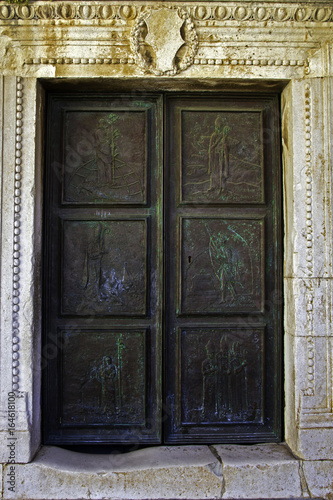Fotografie, Obraz Bronze paneled door of St. Stephen Cathedral in Hvar, Croatia