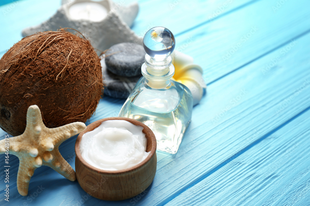 Set for spa treatment with coconut on wooden background
