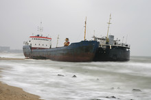 Two Abandoned Ships On The Seashore After Shipwreck