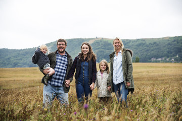 Wall Mural - Family Generations Parenting Togetherness Field Nature Concept