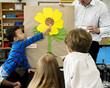 © Rawpixel.com - Diverse group of kindergarten students learning flower structure in science class