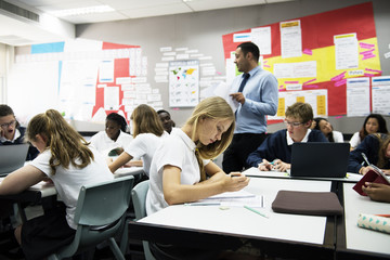 Wall Mural - group of students learning in classroom