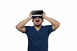 © 24Novembers - Young man with virtual reality goggles.
