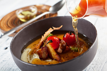 Mushroom Soup with Garlic and Cherry Tomato