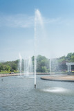 Fototapeta Tęcza - View Of Fountain At Pond in city of China.