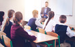 © Africa Studio - Pupils listening teacher in classroom