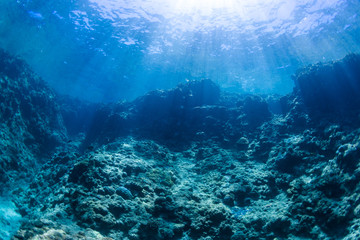 shining sun rays and clear blue ocean