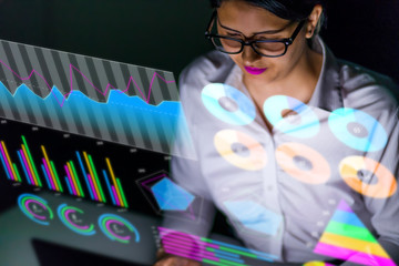 Poster - latina businesswoman looking at various business information.