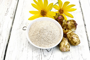 Poster - Flour of Jerusalem artichoke in bowl with flower on light  board