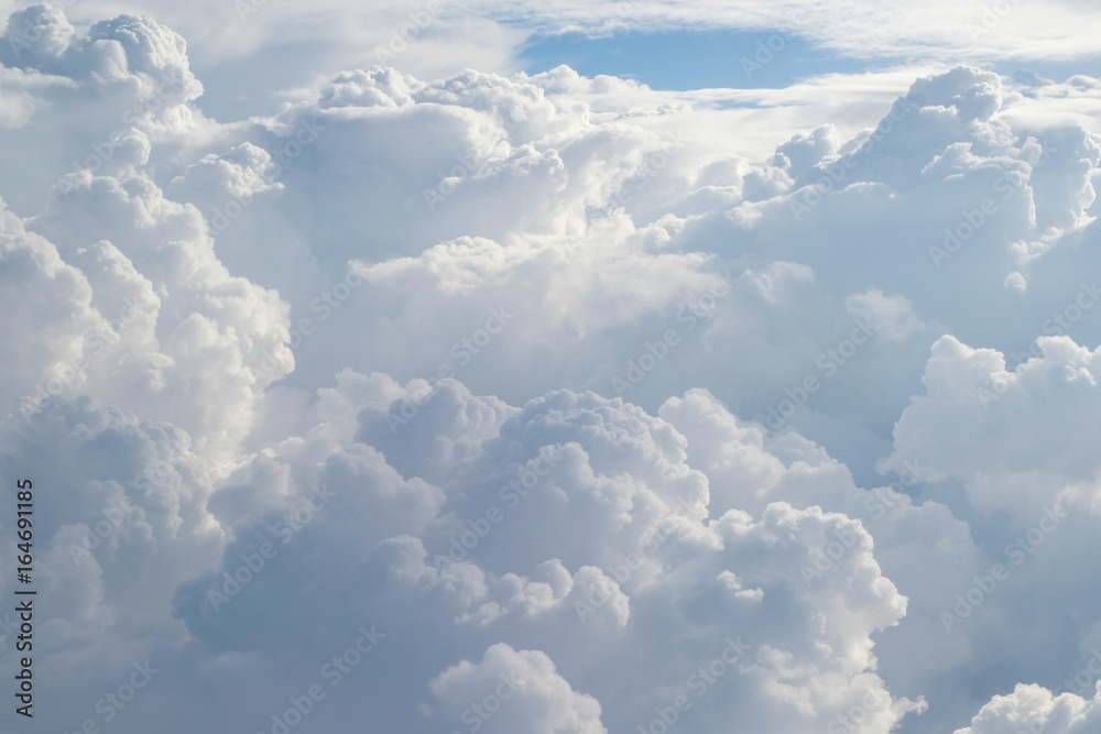 Aerial view from the plane of fluffy rain cloud in daytime - Cloudscape - obrazy, fototapety, plakaty 