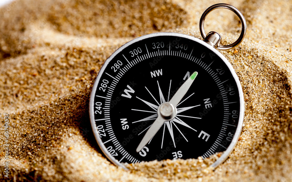 concept compass in sand searching meaning of life - obrazy, fototapety, plakaty 
