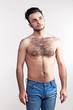 Boy with naked hairy chest on white background