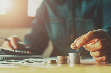 Poster - Saving money woman hand putting coin stack concept business finance.