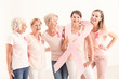 © Photographee.eu - Woman wearing ribbon standing in group
