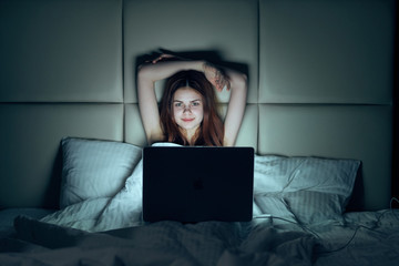 Young beautiful woman working at computer at home