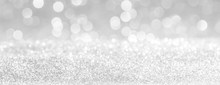 Silver And White Bokeh Lights Defocused. Glitter  Abstract Background