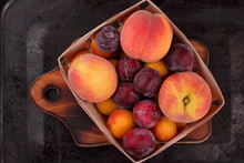 Peaches, Apricots And Plums In The Basket