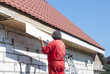© kuchina - builder works on the roof