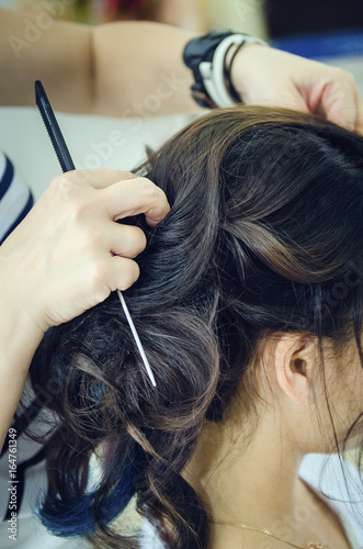 Closeup Of A Professional Hairdresser S Hands Doing A Hairstyle In