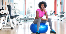 Portrait Of Young Afro American Woman In Gym On Workout Break