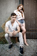 © Maksim Kostenko - Portrait of young modern couple in love, posing outdoors in city street