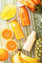 Fruit And Vegetable Smoothies In Glass Jars, Orange Mango Banana Carrot Pineapple