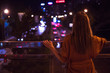 © allenkayaa - Young woman watching the view night city road from bridge