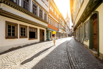 Wall Mural - Young woman tourist walking on the famous Merchants bridge in Erfurt city, Germany