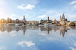 Panoramic view on the riverside of the old town with beautiful reflection on the water during the sunny weather in Dresden city, Germany