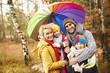 © gpointstudio - Family looking for shelter with umbrella