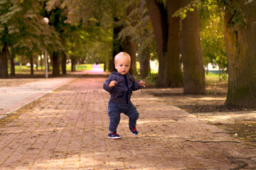 Funny toddler dancing in gangnam style. Outdoor shot