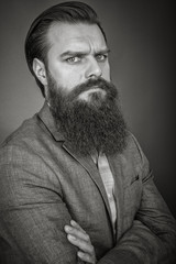 Wall Mural - Studio shot of a young  man with beard and mustache