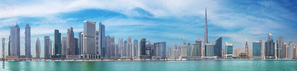DUBAI, UAE - MARCH 29, 2017: The panorama with the new Canal and skyscrapers of Downtown. - obrazy, fototapety, plakaty 