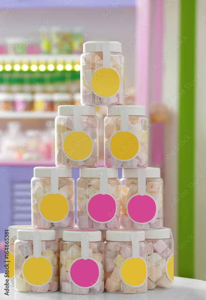 Tasty marshmallow in jars at candy shop