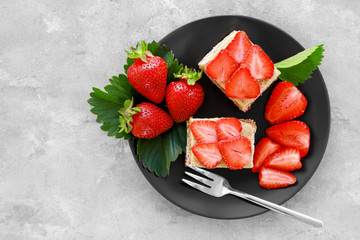 Wall Mural - Two pieces of homemade cake with strawberries on plate