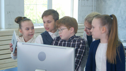 Business children team working together on laptop in office