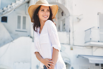 Canvas Print - Young beautiful woman walking the streets of an Italian town