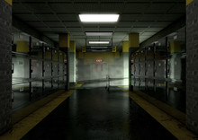 A Look Down The Aisle Of Fridges Of A Dimly Lit Ward In A Mortuary With An Empty Gerney In The Distance - 3D Render
