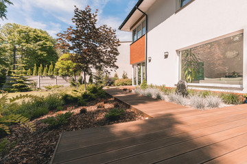 Wooden walkout deck in garden