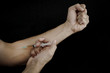 hands making syringe injection of heroin