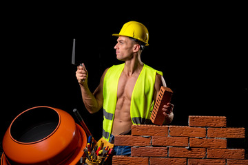 Wall Mural - fit shirtless worker with tools