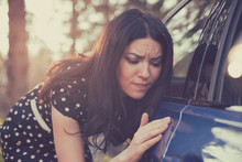 Worried Funny Looking Woman Obsessing About Cleanliness Of Her Car